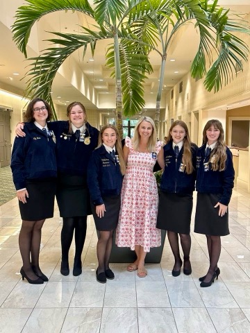 Lily with fellow FFA members and FFA advisor, Mrs. Lawall, at the 2023 Florida FFA state convention