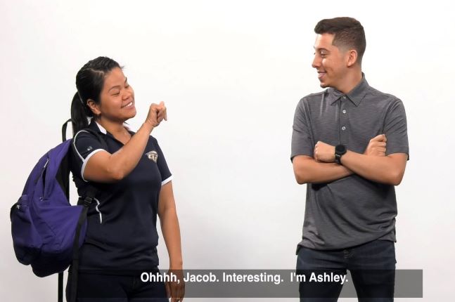 Two students using sign language