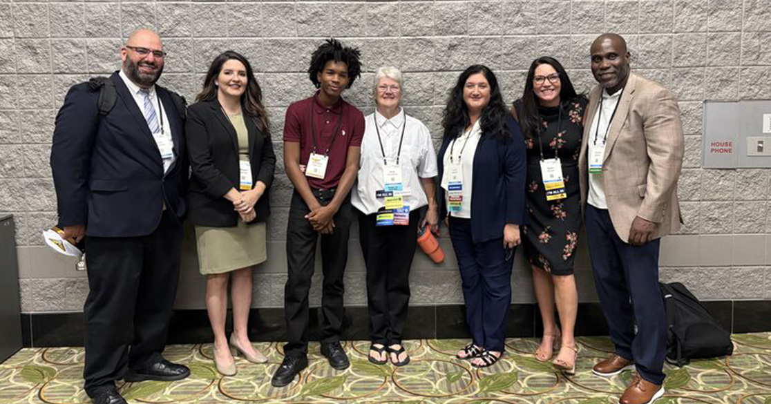 Florida Scholars Academy Graduate Turns Perseverance Into Workforce Success Florida Scholars Academy (FSA) graduate Kahliayah Robinson, center left, is pictured with educators and school leaders after sharing how perseverance and education helped him achieve career success.