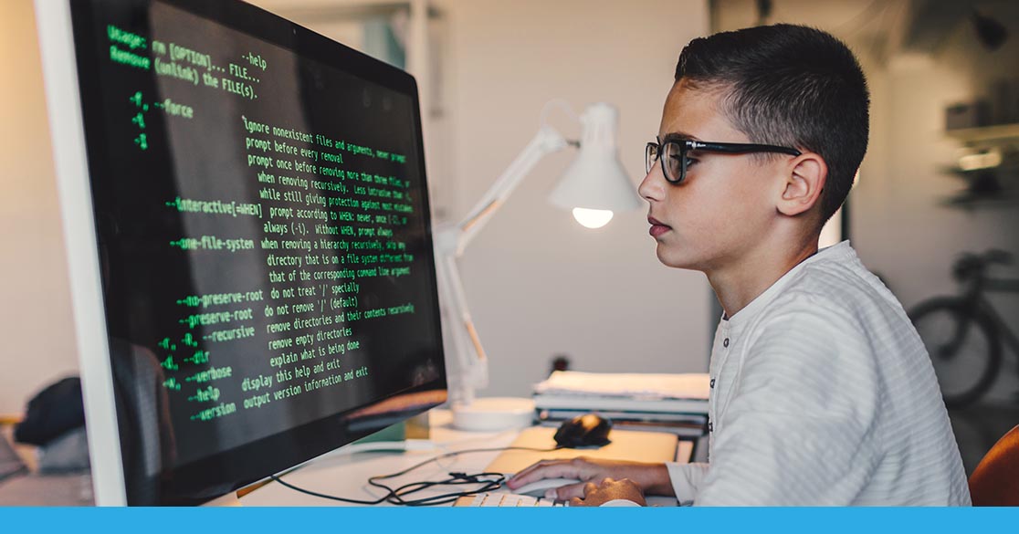 Picture of a student coding on his laptop and earning industry certifications.