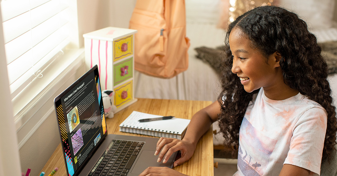 Florida Students Complete More Than 706,000 FLVS Semester Courses in 2025-26 School Year A young girl sits at a laptop doing individual coursework through FLVS Flex.